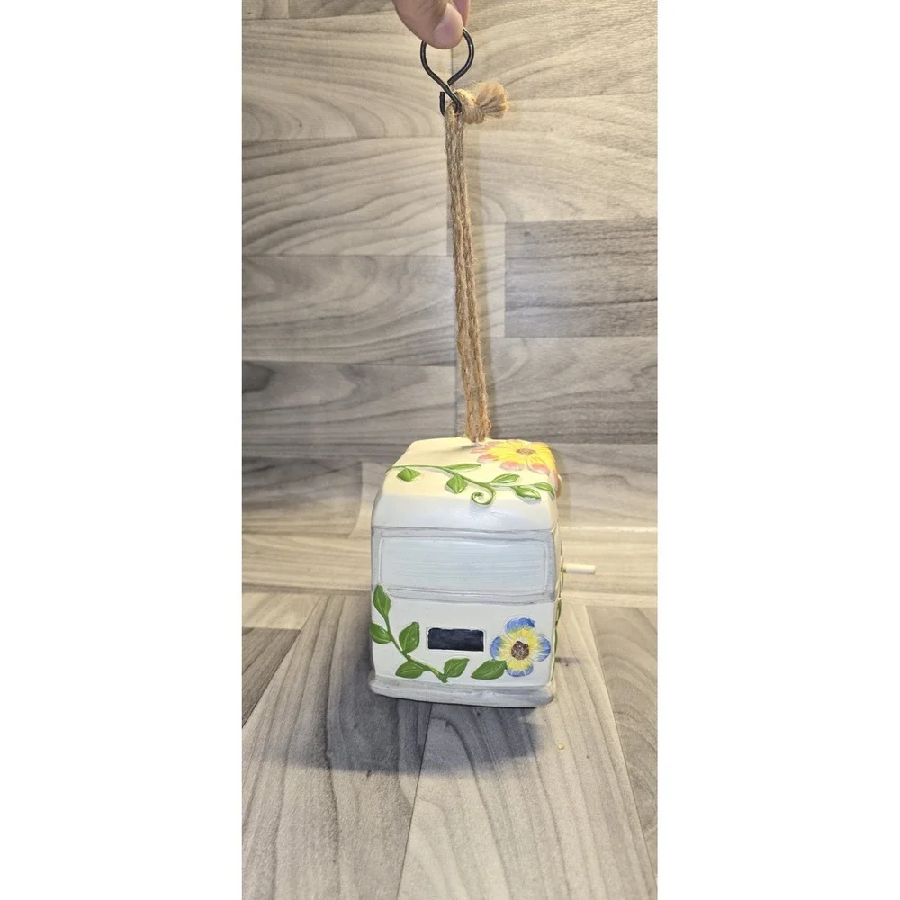 decorative birdhouse styled like a vintage camper van